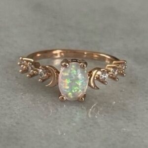 Rose Gold Opal Moon Crystal Ring Size 7 Brand New

Brand New